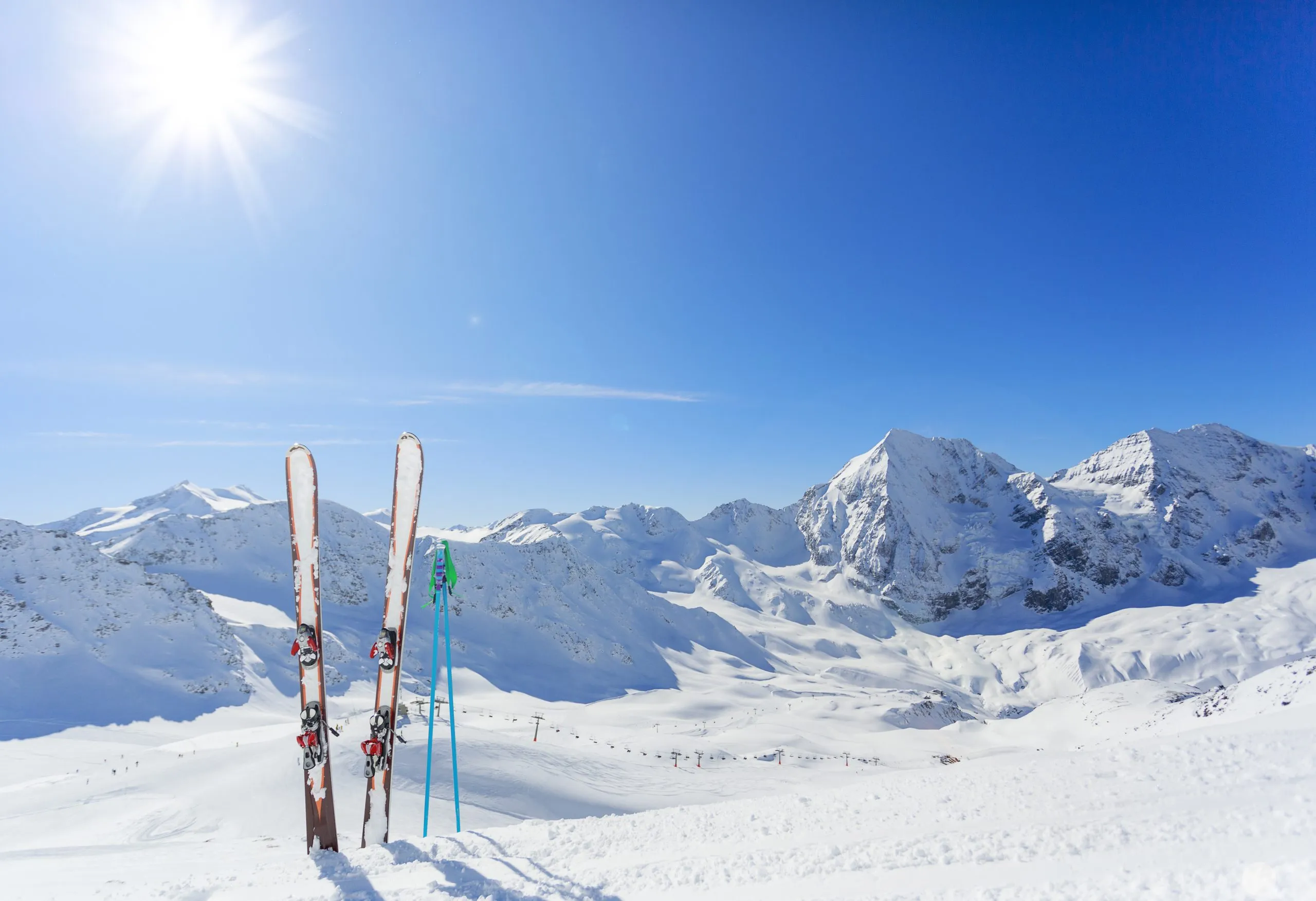 Skiing equipments on ski slope in italian Alps