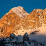 Tofana di Rozes or Tofana I Peak in Cortina d'Ampezzo in Winter at Dawn, Snow Covered at Sunrise with Early Morning Light