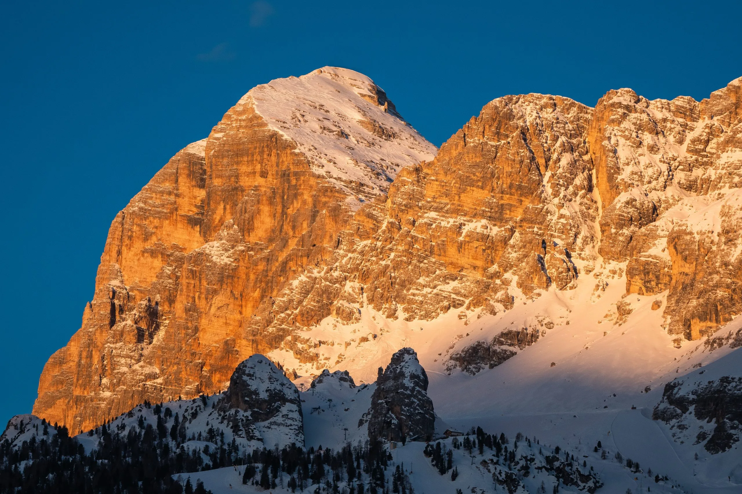 Tofana di Rozes or Tofana I Peak in Cortina d'Ampezzo in Winter at Dawn, Snow Covered at Sunrise with Early Morning Light